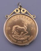 A 1974 fine gold Krugerrand 1 ounce coin in a 9 ct gold hand-made pendant mount. 36.