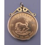 A 1974 fine gold Krugerrand 1 ounce coin in a 9 ct gold hand-made pendant mount. 36.