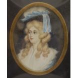 A 19th century miniature painting on ivory of a young lady, framed and glazed. 10.5 x 14 cm overall.