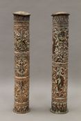 A pair of antique Persian copper scroll boxes with repousse decoration. Each 39.5 cm long.