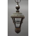 A brass hanging lantern. 64 cm high.