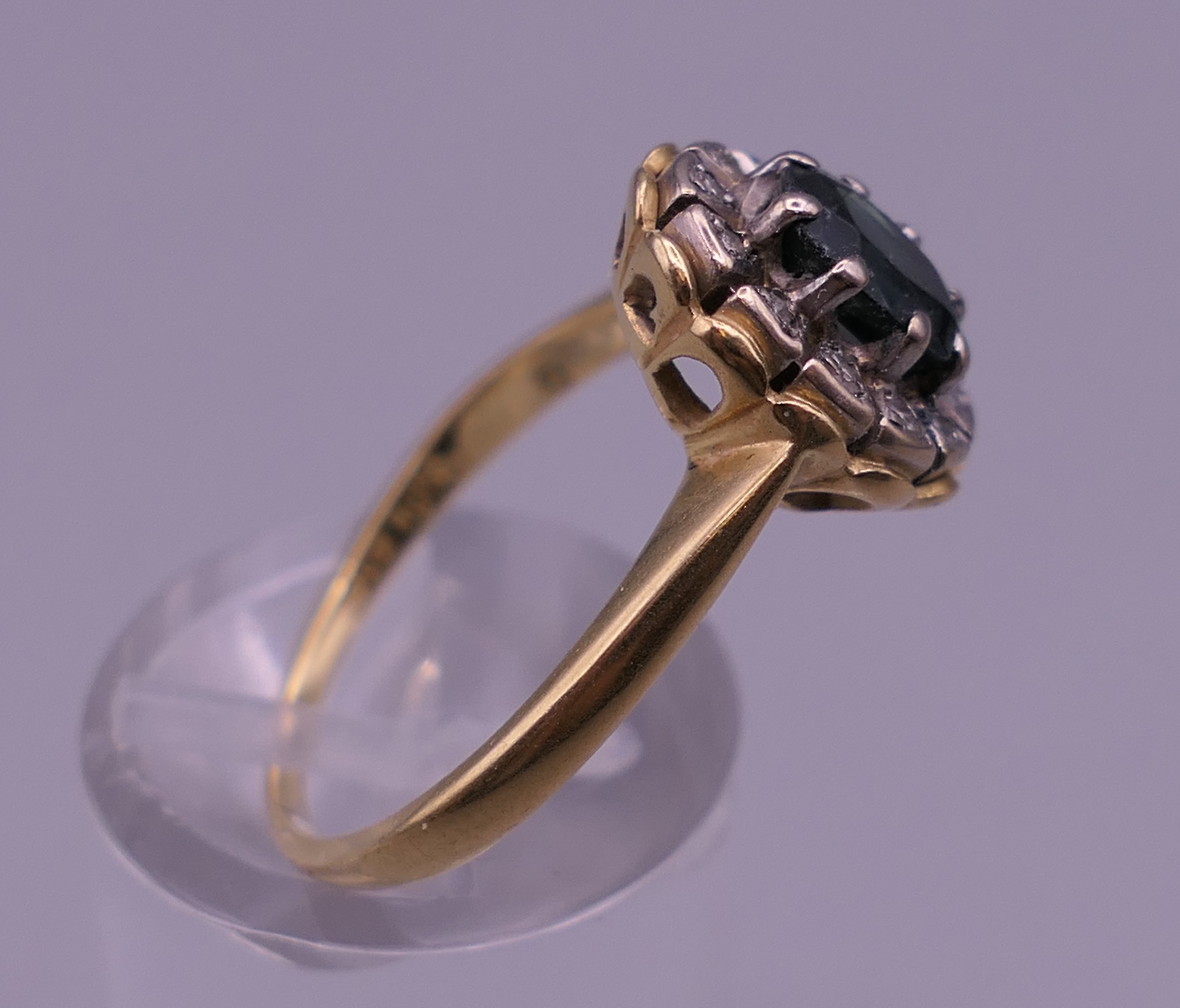 An 18 ct gold diamond and sapphire ring. Ring size P/Q. 4.9 grammes total weight. - Image 2 of 6
