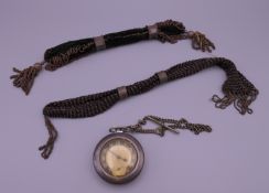 Two Victorian miser purses and a pocket watch.
