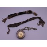 Two Victorian miser purses and a pocket watch.