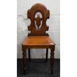 A Victorian mahogany hall chair.