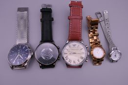 A bag of five wristwatches.