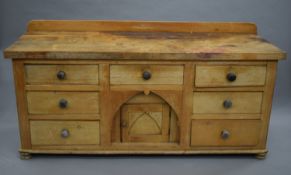 An early 19th century sycamore and pine dresser base. 183 cm long.
