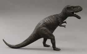 A bronze model of a dinosaur. 27 cm high.