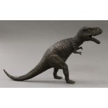 A bronze model of a dinosaur. 27 cm high.