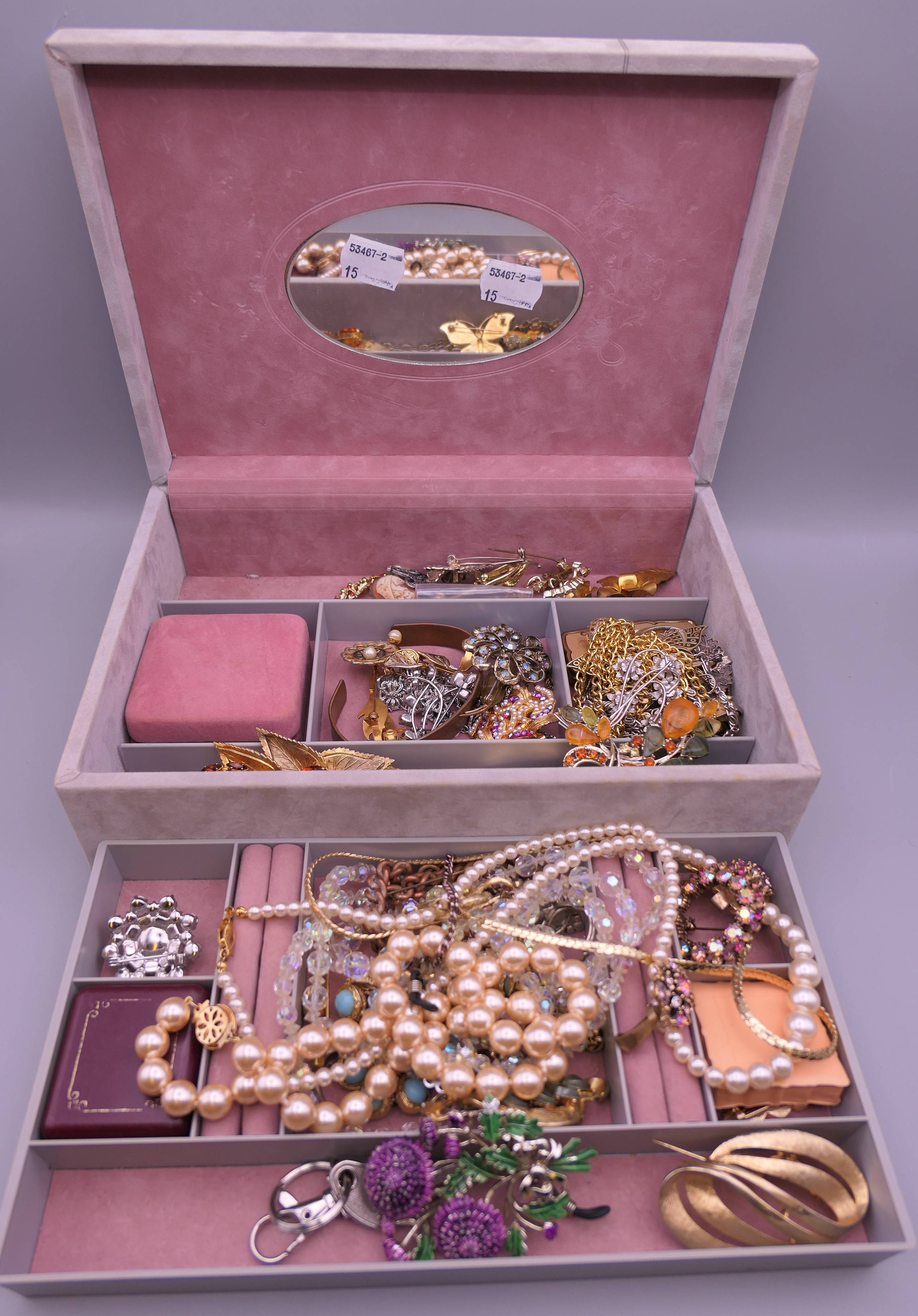 A box of miscellaneous costume jewellery.