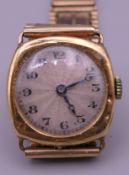 A 9 ct gold gentleman's wristwatch. 39.9 grammes total weight.
