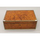 A 19th century brass bound burr wood travelling silver box. 48 cm wide.