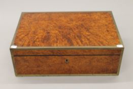 A 19th century brass bound burr wood travelling silver box. 48 cm wide.