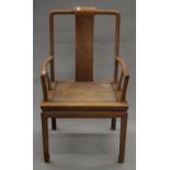 A Chinese hardwood open arm chair. 56 cm wide.