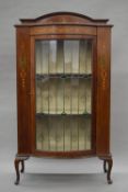 An Edwardian mahogany lead glazed bow fronted display cabinet. 90 cm wide.