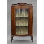 An Edwardian mahogany lead glazed bow fronted display cabinet. 90 cm wide.