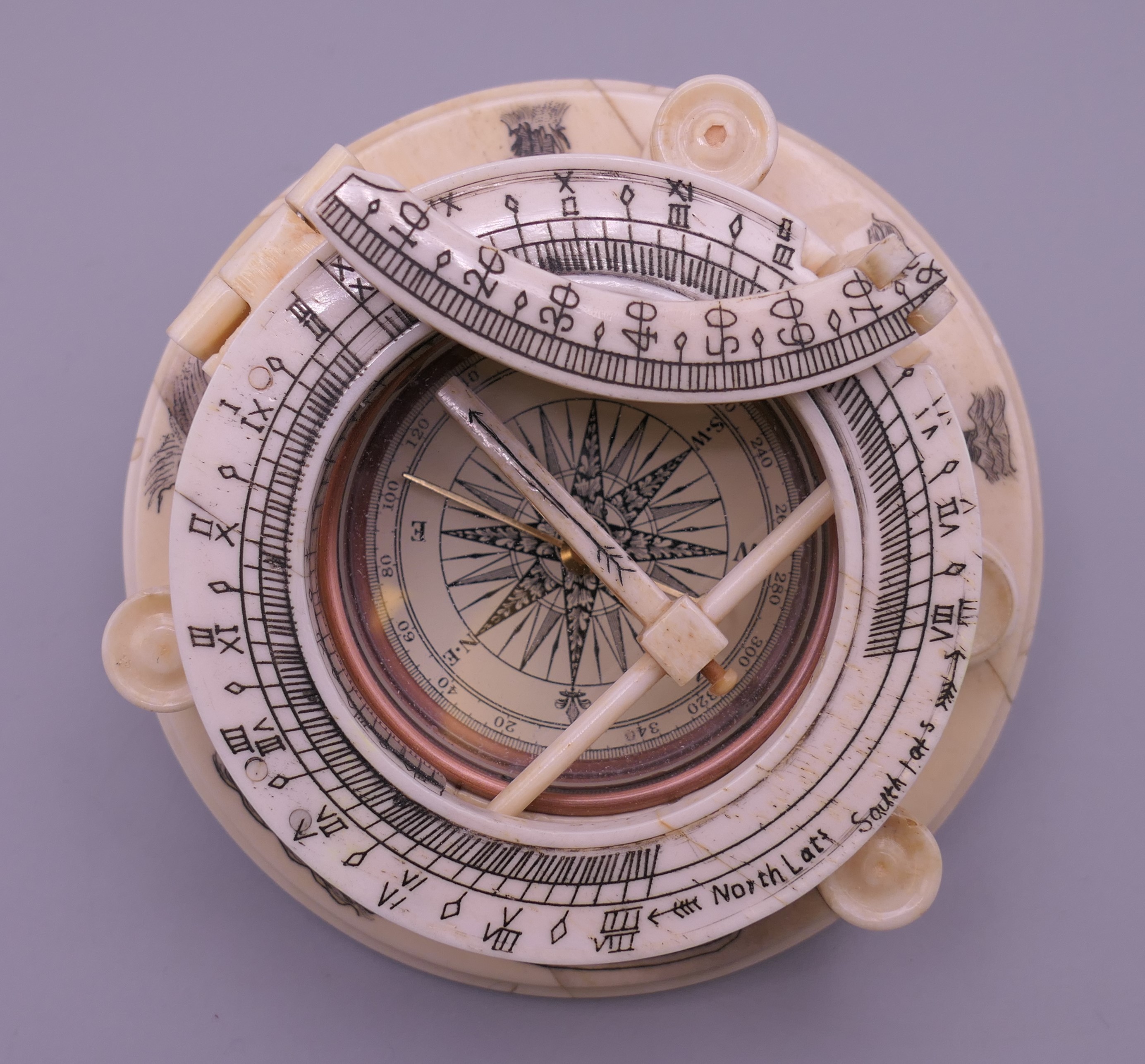 A bone compass. 10.25 cm diameter.