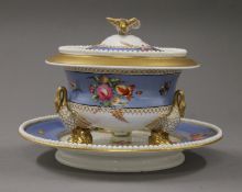 A 19th century porcelain lidded tureen on stand. 14 cm high, stand 23 cm diameter.