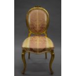 A 19th century upholstered carved giltwood salon chair. 45 cm wide.