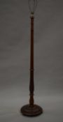 A carved mahogany standard lamp. 173 cm high overall.