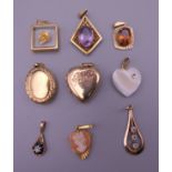 A quantity of various gold and other pendant and lockets. 19.4 grammes total weight.