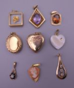 A quantity of various gold and other pendant and lockets. 19.4 grammes total weight.