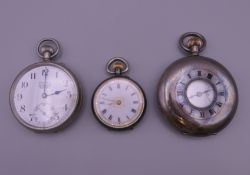 A silver pocket watch, a silver fob watch and a plated pocket watch.