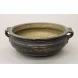 An 18th/19th century Indian patinated bronze Urli temple bowl. 21.5 cm wide.