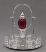A cranberry glass bird decanter set. 41 cm high.