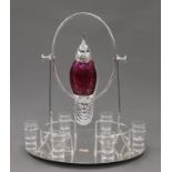 A cranberry glass bird decanter set. 41 cm high.