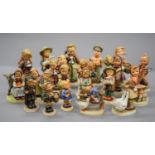 A collection of Hummel figures.