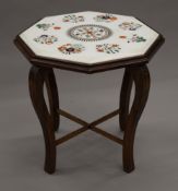 An inlaid marble topped octagonal occasional table. 52 cm wide.