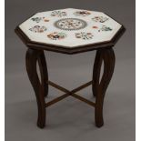 An inlaid marble topped octagonal occasional table. 52 cm wide.