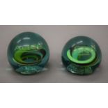 A pair of glass paperweights, one inscribed Fred, the other Alice. The latter 7.5 cm high.