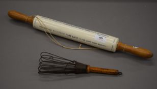 An advertising pottery rolling pin with four lines advert and a Bournville Cocoa whisk.