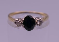 An 18 ct gold diamond and sapphire ring. Ring size P/Q. 2.1 grammes total weight.
