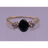 An 18 ct gold diamond and sapphire ring. Ring size P/Q. 2.1 grammes total weight.