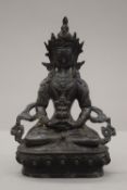 A Sino Tibetan bronze model of buddha. 20.
