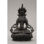 A Sino Tibetan bronze model of buddha. 20.