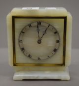 An alabaster clock. 17.5 cm high.
