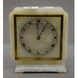 An alabaster clock. 17.5 cm high.