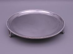 A small silver waiter. 15 cm diameter. 162.8 grammes.