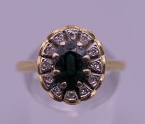 An 18 ct gold diamond and sapphire ring. Ring size P/Q. 4.9 grammes total weight.