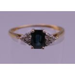 An 18 ct gold sapphire ring. Ring size R/S. 2.6 grammes total weight.