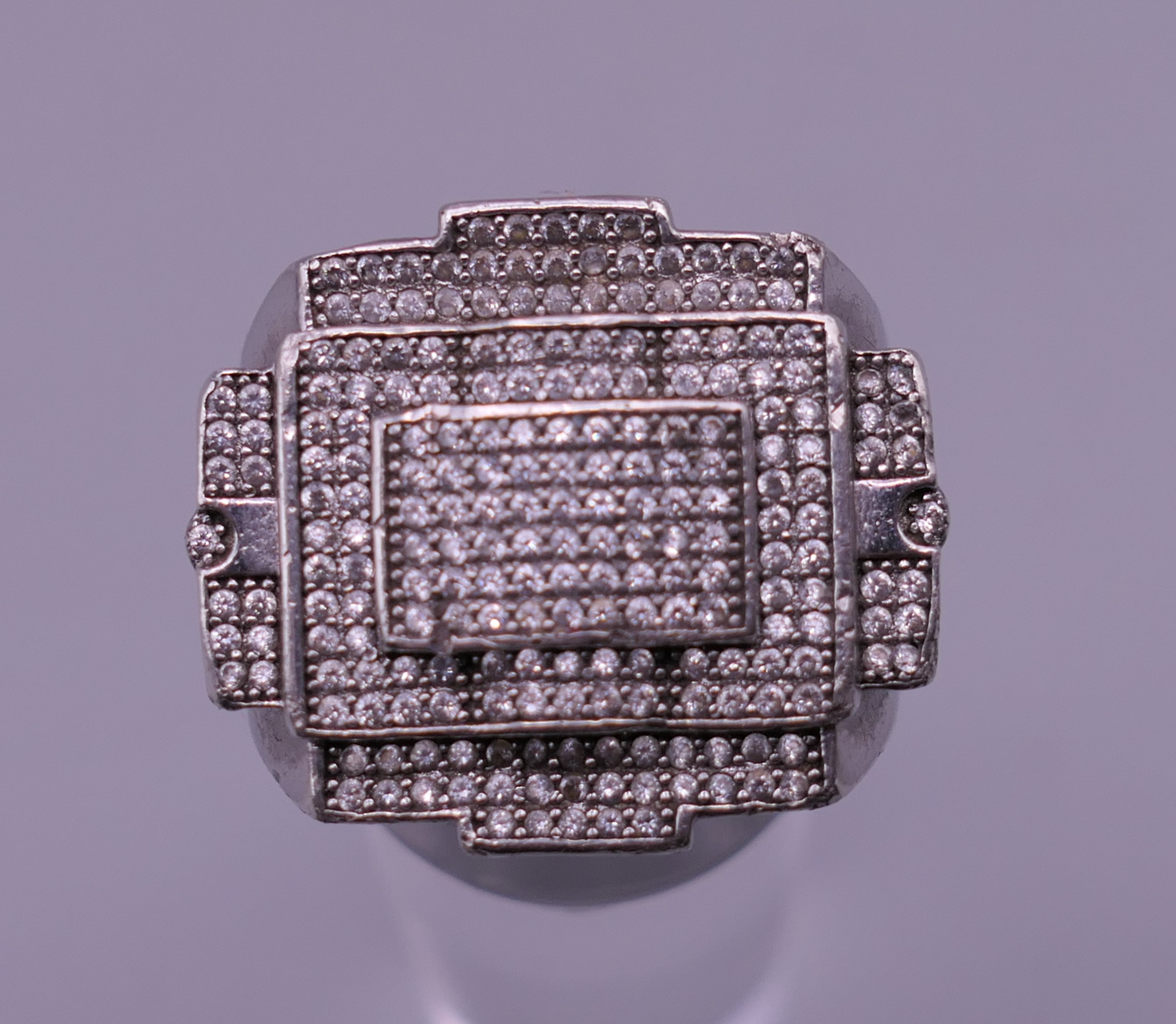 A gentleman's Deco style diamond set ring. Ring size Q. 12 grammes total weight.