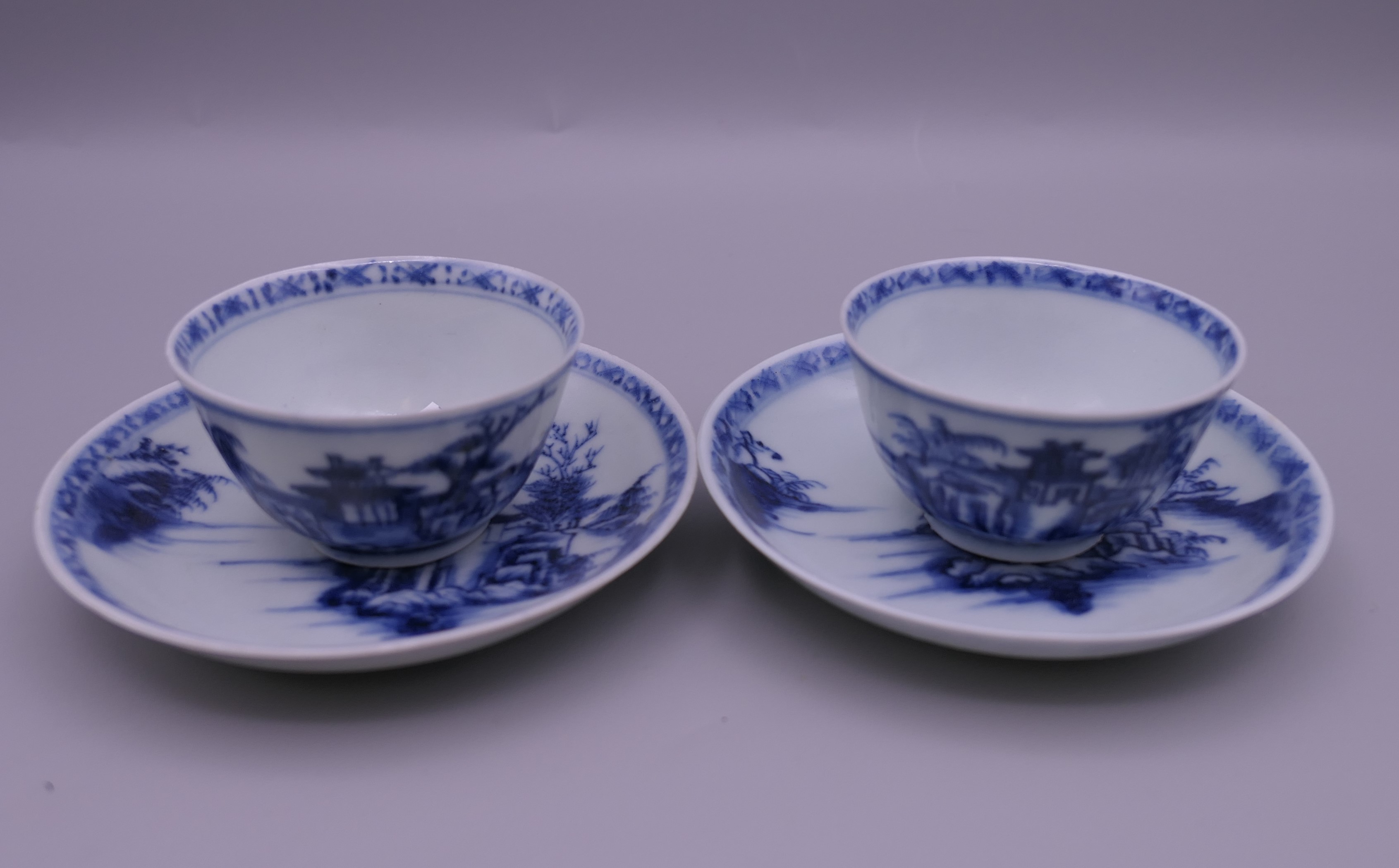 Two Nanking Cargo Chinese blue and white porcelain tea bowls and saucers.