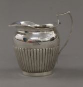 A Victorian silver cream jug. 10 cm high. 159.6 grammes.