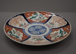 A 19th century Imari charger. 38 cm diameter.