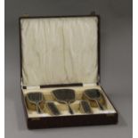 A boxed silver and tortoiseshell dressing table set.