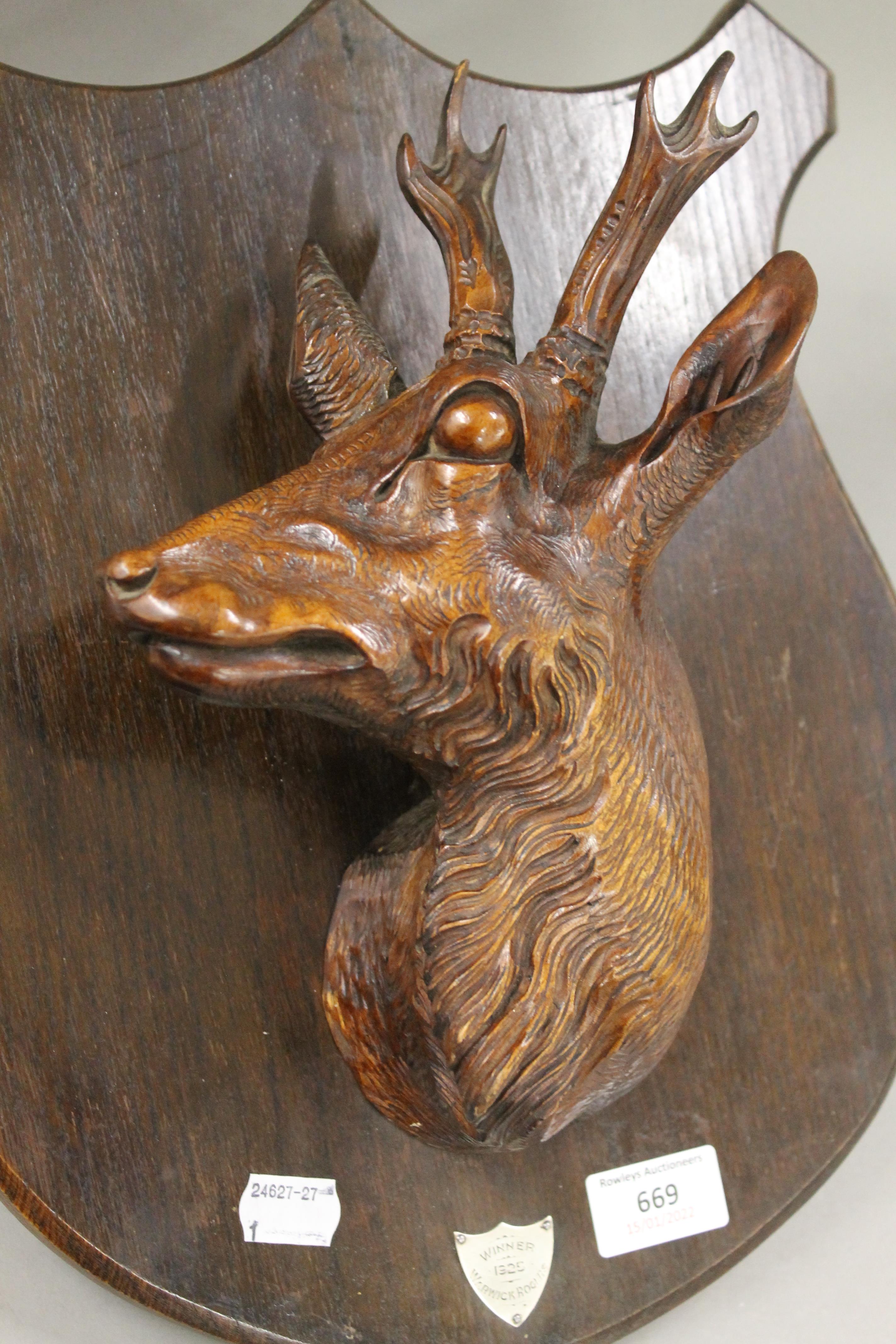 A pair of carved 1920's stag head trophy shields. 37 cm high. - Image 6 of 7